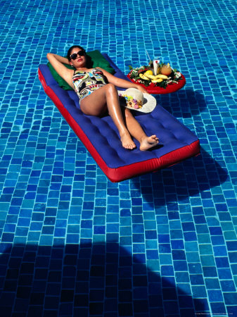 Woman Floating In Pool At Calinda Quality Hotel, Morelia, Michoacan De Ocampo, Mexico by John Neubauer Pricing Limited Edition Print image