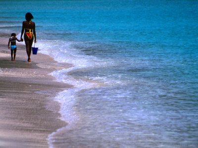 Mother And Daughter Walking Along Beach, St. Martin by Jerry Alexander Pricing Limited Edition Print image