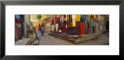 Market Vendor Sitting At A Market Stall, Jaisalmer, Rajasthan, India by Panoramic Images Pricing Limited Edition Print image