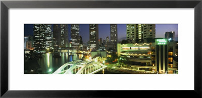 Buildings Lit Up At Night, Singapore by Panoramic Images Pricing Limited Edition Print image
