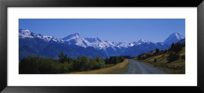 Empty Road Leading Towards Snowcapped Mountains, Mt. Cook, Southern Alps, New Zealand by Panoramic Images Pricing Limited Edition Print image