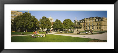 Group Of People Sitting Around A Fountain In A Park, Stuttgart, Baden-Wurttemberg, Germany by Panoramic Images Pricing Limited Edition Print image