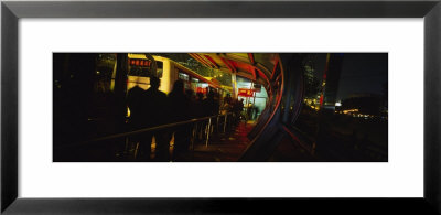 Silhouette Of People Waiting For Bus At A Bus Stop, People's Square, Shanghai, China by Panoramic Images Pricing Limited Edition Print image