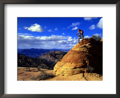 Biker Challenges Slickrock Near Rockville, Utah, Usa by Howie Garber Pricing Limited Edition Print image
