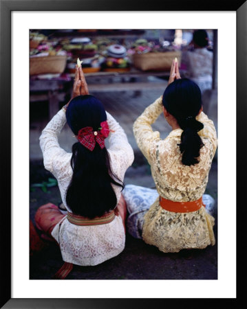 Praying At A Temple Ceremony At Pura Dalem In Peliatan, Peliatan, Indonesia by Adams Gregory Pricing Limited Edition Print image