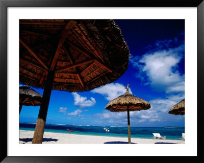 Thatched Umbrellas On An Beach, Trou D'eau Douce, Mauritius by Jean-Bernard Carillet Pricing Limited Edition Print image