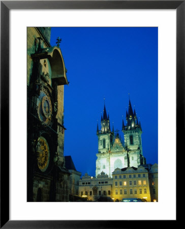 Trinity Church At Night Behind Town Hall And Astronomical Clock, Prague, Czech Republic by Richard Nebesky Pricing Limited Edition Print image