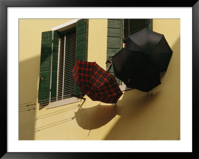 Three Umbrellas Hang Outside A Window by Raul Touzon Pricing Limited Edition Print image
