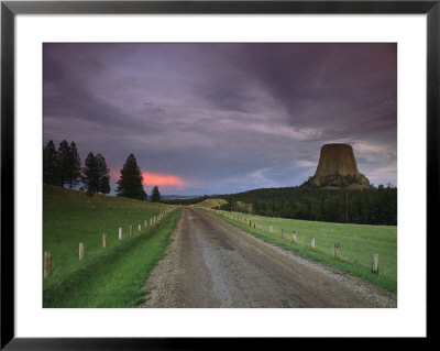 Twilight View Down A Dirt Road Towards Devils Tower by Bill Hatcher Pricing Limited Edition Print image