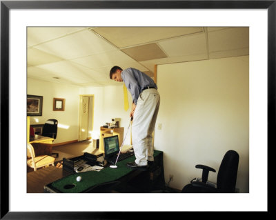 A Man Plays Golf On His Desk by Joel Sartore Pricing Limited Edition Print image