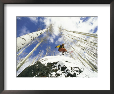 Snowboarder Jumps Off A Rock In Telluride, Telluride, Colorado by Paul Chesley Pricing Limited Edition Print image