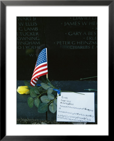 Rose, Flag, And Note Of Remembrance Left By A Family At Memorial Wall by Klaus Nigge Pricing Limited Edition Print image