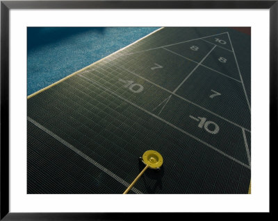 Setting Up For A Shot On A Shuffleboard Game On A Cruise Ship by Todd Gipstein Pricing Limited Edition Print image