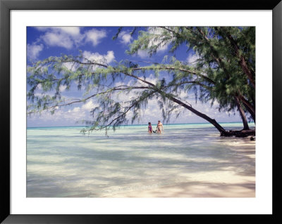 View Of Couple Wading In Water, Cayman Islands by Anne Flinn Powell Pricing Limited Edition Print image