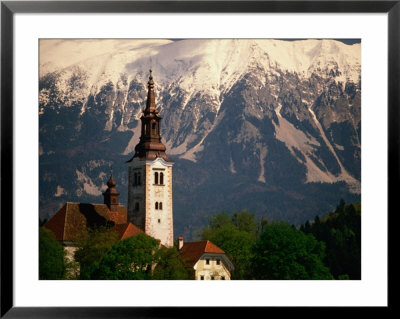 The Belfry Of The Church Of The Assumption On Bled Island And The Julian Alps, Gorenjska, Slovenia by Jon Davison Pricing Limited Edition Print image