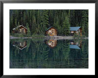 Lake Ohara Lodge Cabins Reflected On The Surface Of Lake Ohara by Michael Melford Pricing Limited Edition Print image