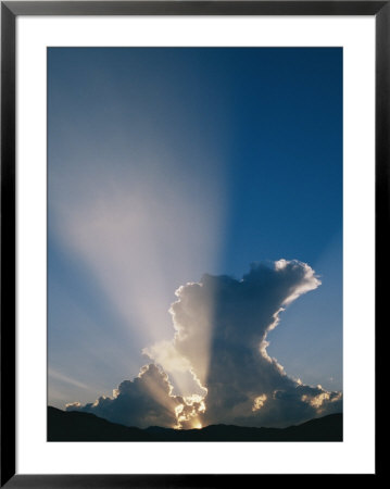 The Suns Rays Stream Through The Clouds At Sunset by Marc Moritsch Pricing Limited Edition Print image