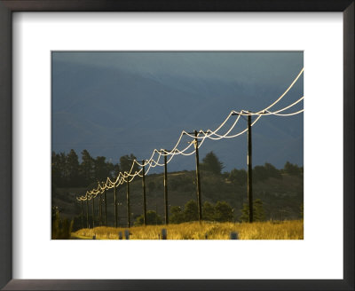 Power Lines By Road Side Reflecting Evening Light, New Zealand by Tobias Bernhard Pricing Limited Edition Print image