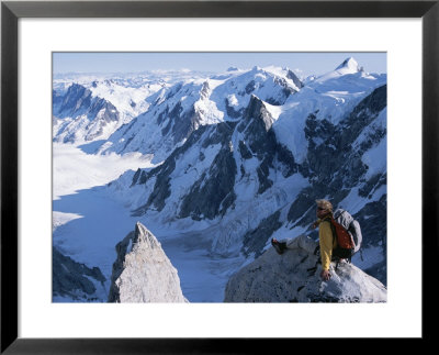 A Man Enjoying The Breathtaking View From Mount Combatant by Jimmy Chin Pricing Limited Edition Print image