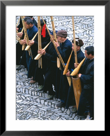 Miao Men Playing Traditional Bamboo Musical Instrument, China by Keren Su Pricing Limited Edition Print image