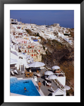 Pool Perched On Hillside With Village Houses, Fira, Santorini Island, Greece by Diana Mayfield Pricing Limited Edition Print image