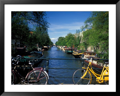Yellow Bicycle And Canal, Amsterdam, Netherlands by Nik Wheeler Pricing Limited Edition Print image