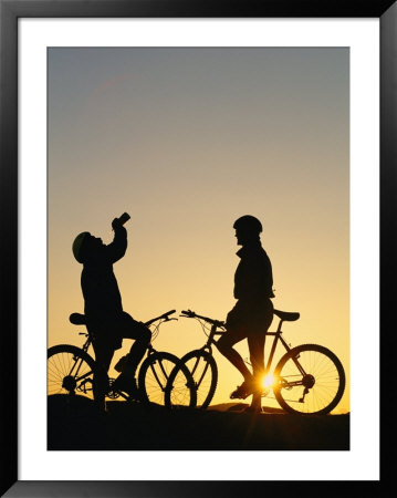 Mountain Bikers Take A Water Break While On The Trail by Dugald Bremner Pricing Limited Edition Print image