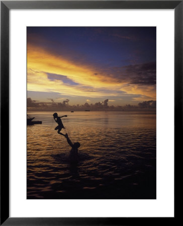 Father Playfully Throwing Son In Water by Barry Winiker Pricing Limited Edition Print image