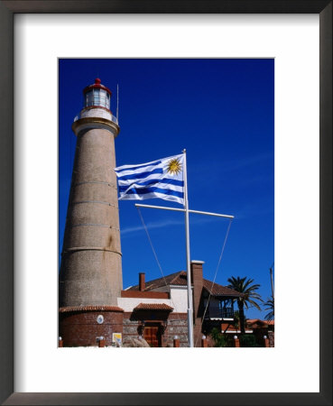Uruguayan Flag Flying Before Faro (Lighthouse), Punta Del Este, Uruguay by Wayne Walton Pricing Limited Edition Print image