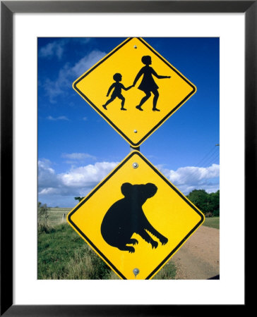 Children Crossing And Koala Crossing Signs On Dirt Road, Wonthaggi, Australia by Richard Nebesky Pricing Limited Edition Print image