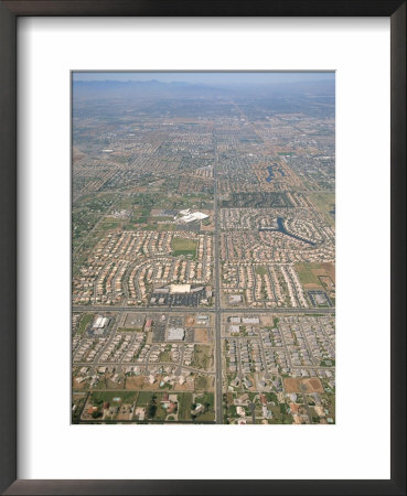 An Aerial View Of A Highly Developed Area Of Urban Sprawl by Rich Reid Pricing Limited Edition Print image