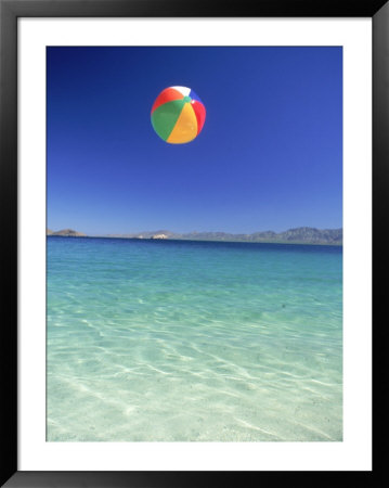 Beach Ball In Air Over Water At Beach by David Porter Pricing Limited Edition Print image