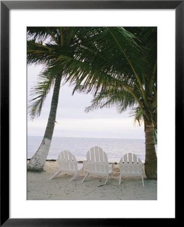 White Beach Chairs Line The Shore Of The Caribbean Sea In Belize by Stephen Alvarez Pricing Limited Edition Print image