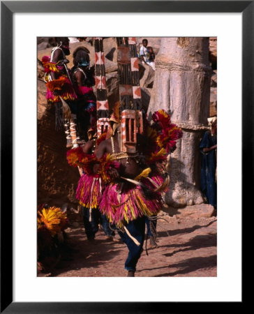 Masked Dancers Perform A Funeral Ceremony For A Departed Member Of The Tirelli Village, Mali by Patrick Syder Pricing Limited Edition Print image