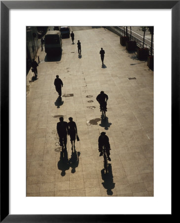 People Walk Along The Bund Casting Shadows by Eightfish Pricing Limited Edition Print image