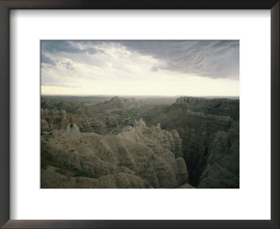 A Storm Moves Over Sheep Mountain Table In Badlands National Park by Annie Griffiths Belt Pricing Limited Edition Print image