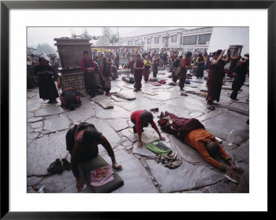 Buddhist Pilgrims Outside Jokhang Temple In Lhasa, Tibet by Gordon Wiltsie Pricing Limited Edition Print image