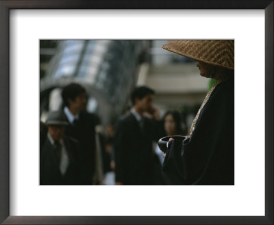 Monk Solicits Alms From People Passing Through A Train Station by Eightfish Pricing Limited Edition Print image