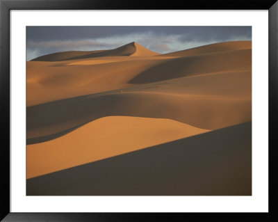 The Vast Dunes Of The Sahara Desert Are Bathed In Evening Light by Peter Carsten Pricing Limited Edition Print image