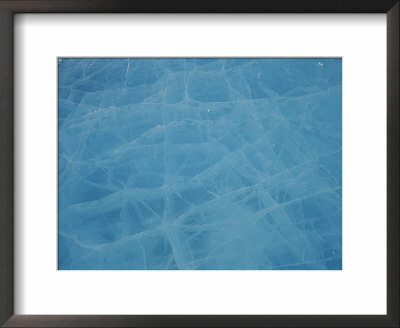 A Thick Piece Of Ice Reflects Blue Light From Its Cracked Surface by Norbert Rosing Pricing Limited Edition Print image