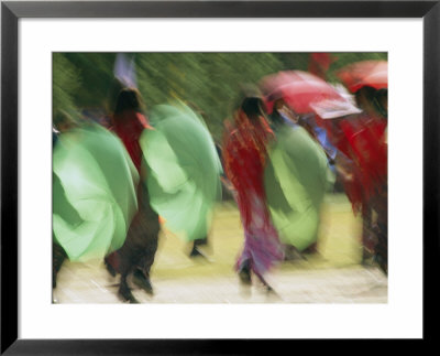 Brightly Colored Umbrellas Are Twirled At A Festival In Thimphu by Michael Melford Pricing Limited Edition Print image