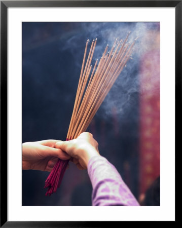 Worshipper Burning Incense In The Wong Tai Sin Temple, Kowloon, China by Michael Coyne Pricing Limited Edition Print image