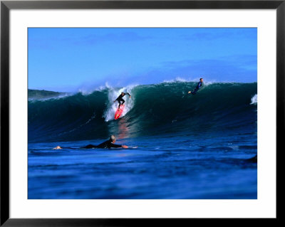 Surfers In Manu Bay, New Zealand by Paul Kennedy Pricing Limited Edition Print image