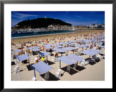 Striped Sunshades At Playa De La Concha With Mt. Urgull In Background, San Sebastian, Spain by Dallas Stribley Pricing Limited Edition Print image
