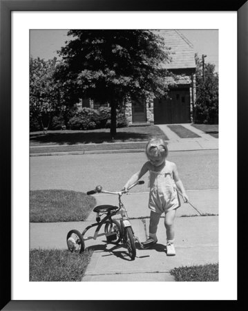 Child Playing With Tricycle by Alfred Eisenstaedt Pricing Limited Edition Print image