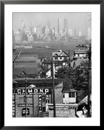 Lower Manhattan And Ferry Docks With Aid Of A Telephoto Lens Over The Rooftops In Staten Island by Andreas Feininger Pricing Limited Edition Print image