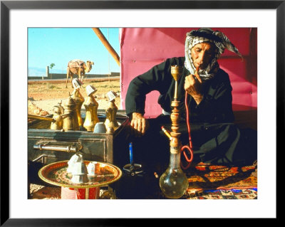 Arab Shepherd Smoking His Hookah As He Relaxes In A Roadside Tea Tent by Carlo Bavagnoli Pricing Limited Edition Print image