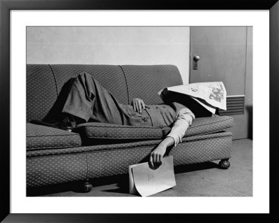 Writer Niven Busch Lying On Sofa With Newspaper Over His Face As He Takes Nap From Screenwriting by Paul Dorsey Pricing Limited Edition Print image