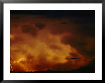 Lightning Bolts Crack Across A Menacing Sky Above Lake Tanganyika by Michael Nichols Pricing Limited Edition Print image