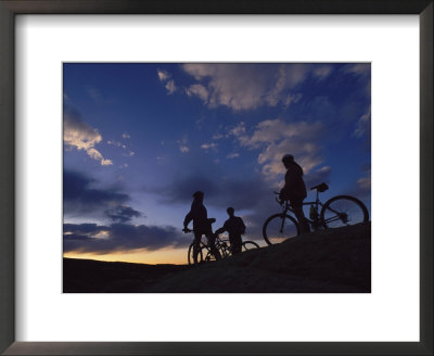 Cyclists Silhouetted Against A Cloudy Sky by Bill Hatcher Pricing Limited Edition Print image